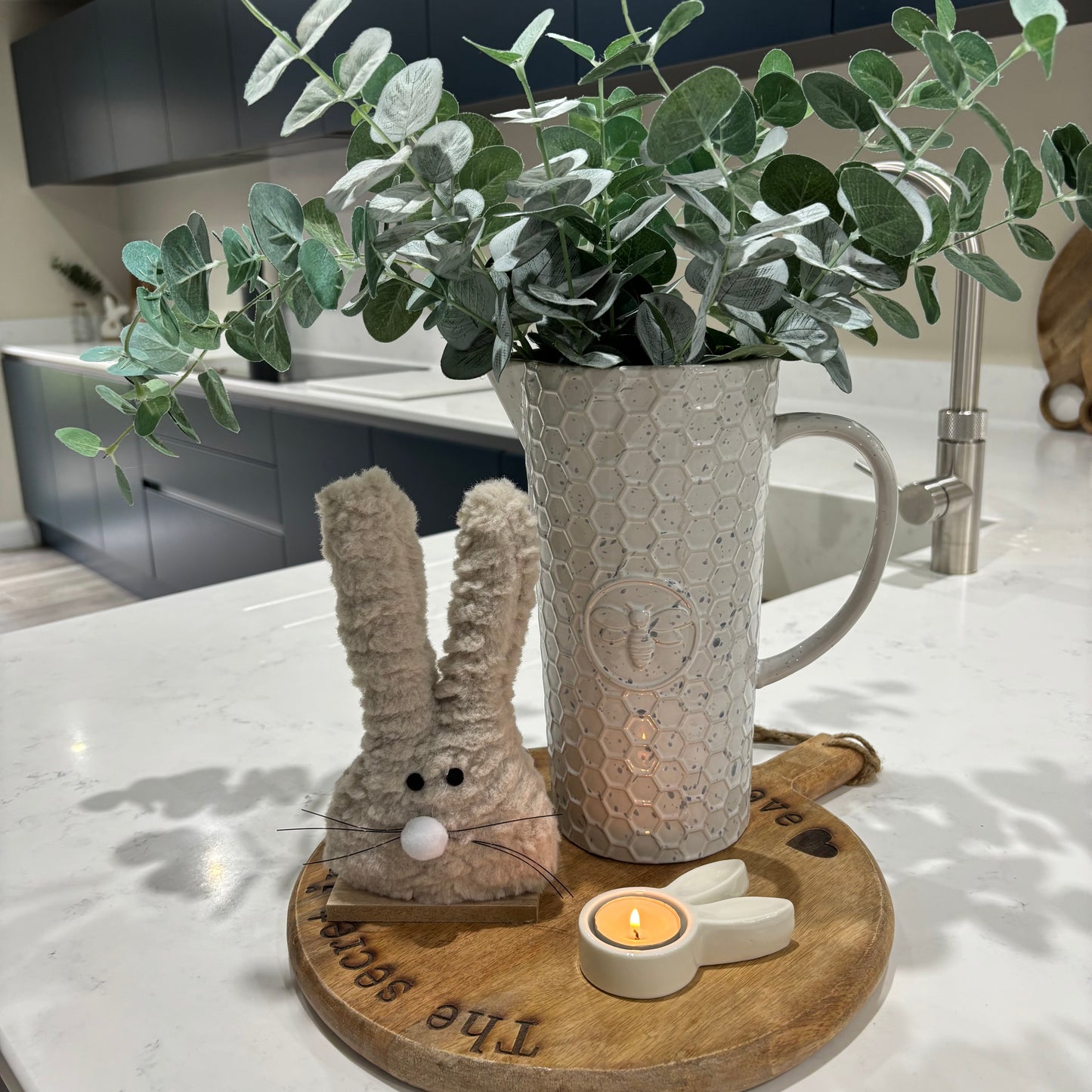 Fluffy bunny on wood base