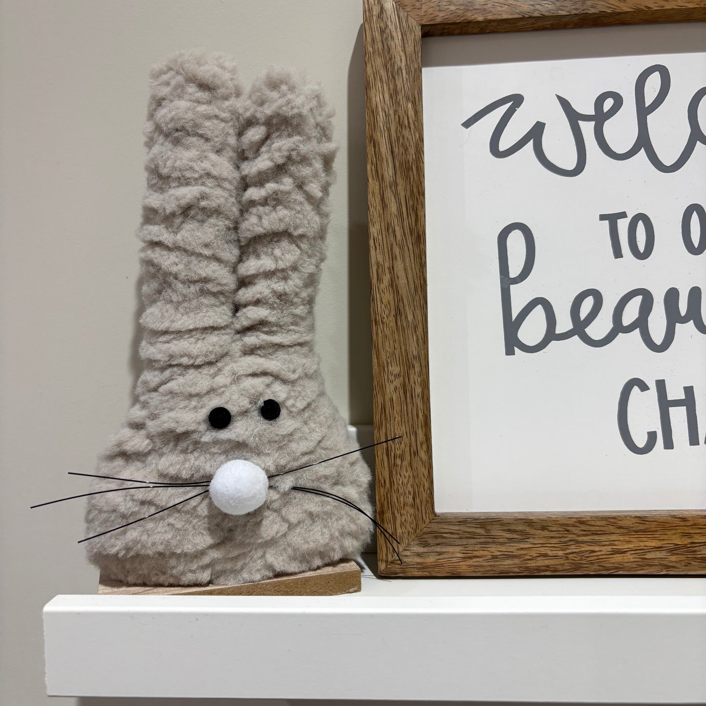 Fluffy bunny on wood base