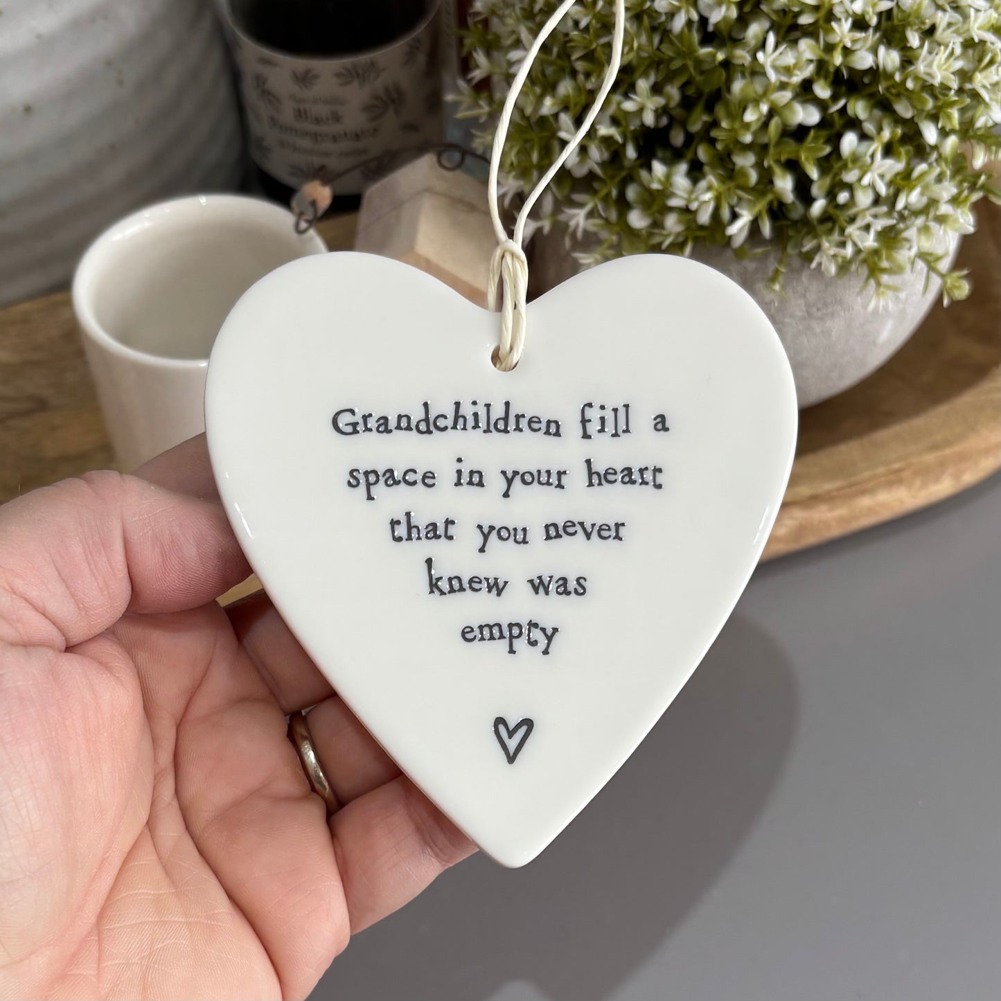 Grandchildren fill a space hanging heart