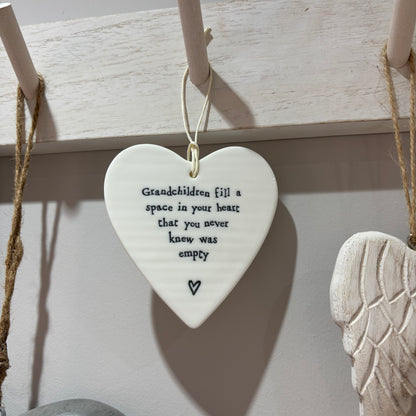 Grandchildren fill a space hanging heart