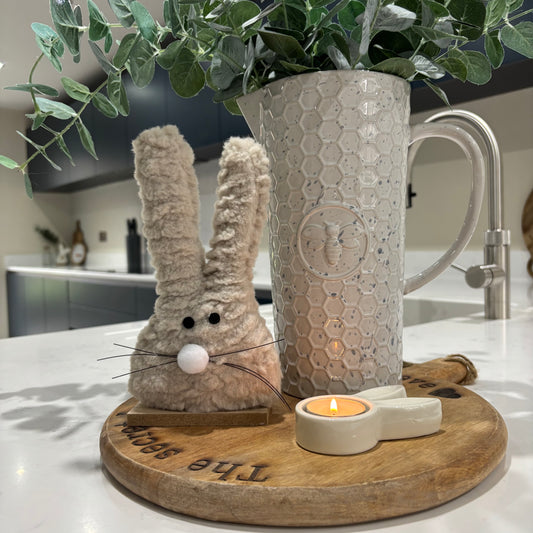 Fluffy bunny on wood base